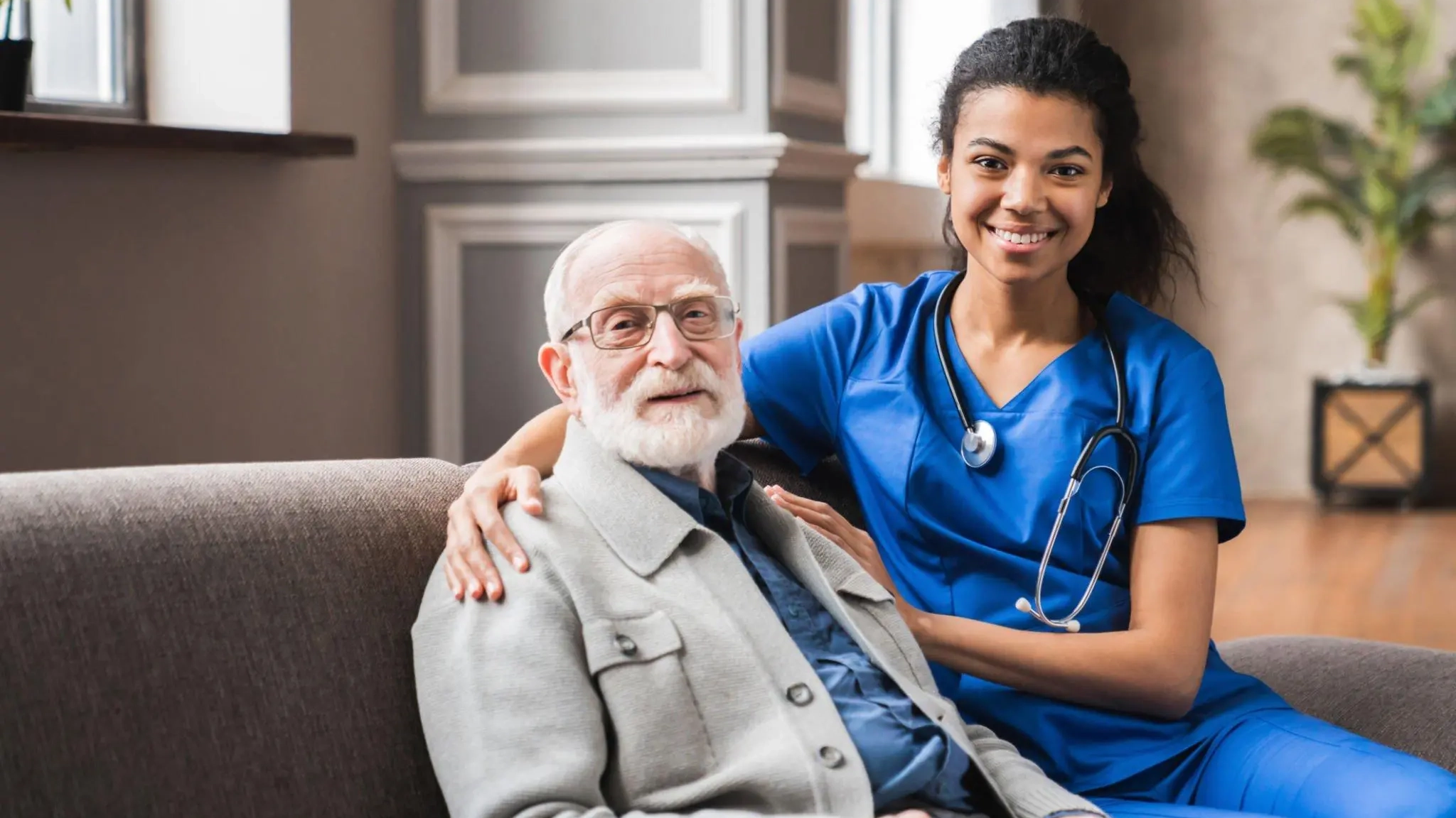 carers-with an elderly man sat on a sofa